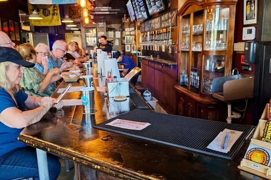 Engine 15 Brewing Co. bar with 50 taps and customers at the bar, Jacksonville Beach
