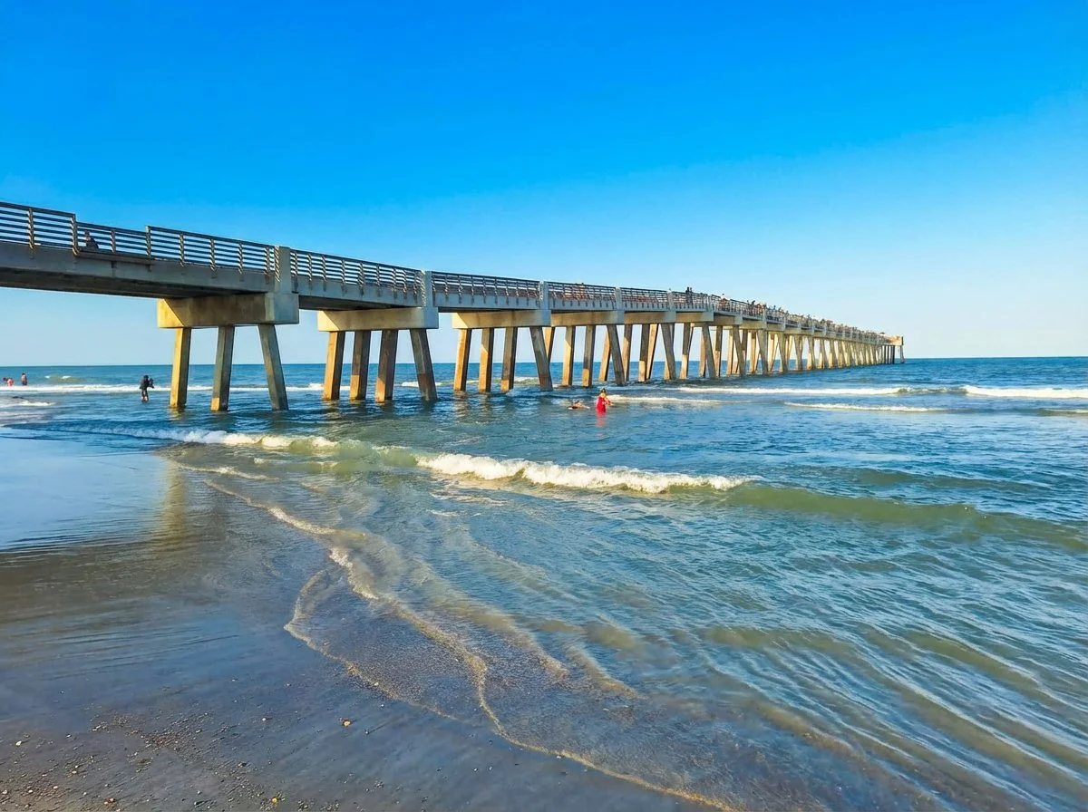 Jacksonville Beach Fishing Pier extending into the Atlantic Ocean at golden hour, 1300 feet of pier into the sea