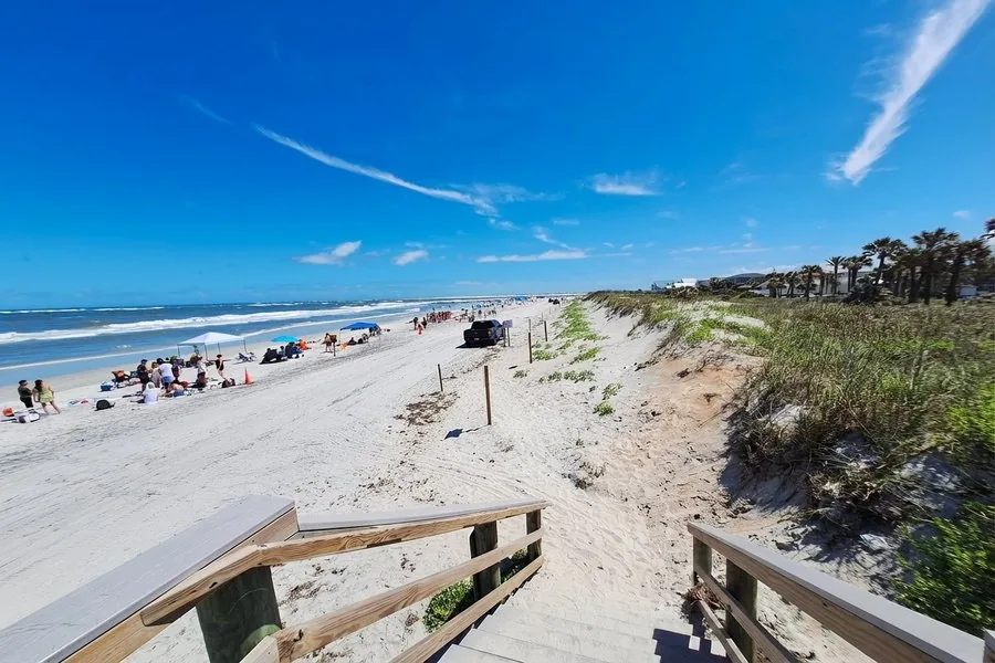 Vilano Beach looking north along the Atlantic coastline, white sand and clear blue water, St. Augustine Florida
